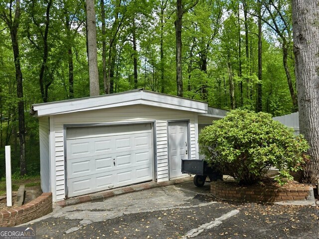 detached garage featuring driveway