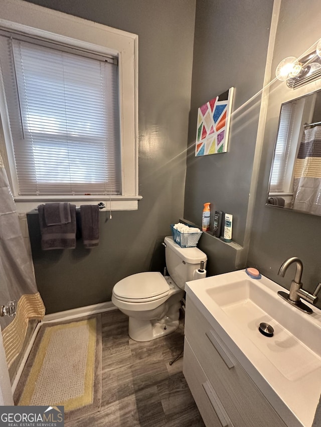 bathroom with toilet and vanity