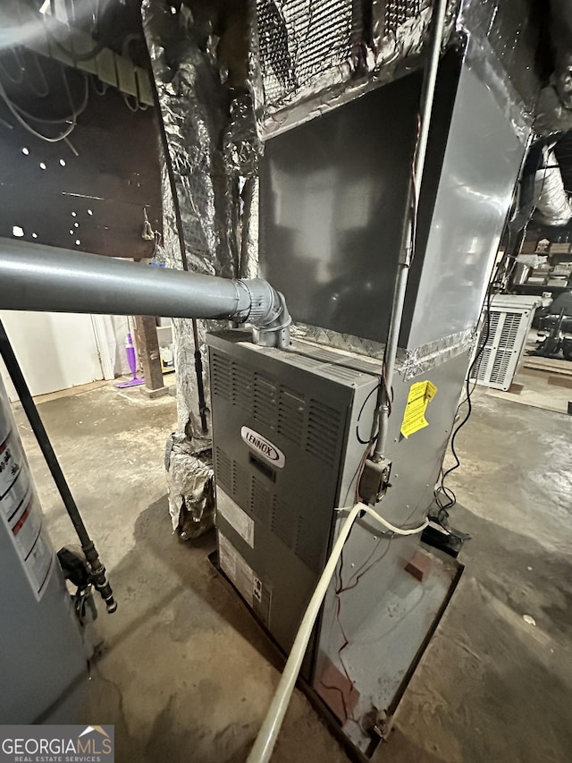 utility room with heating unit