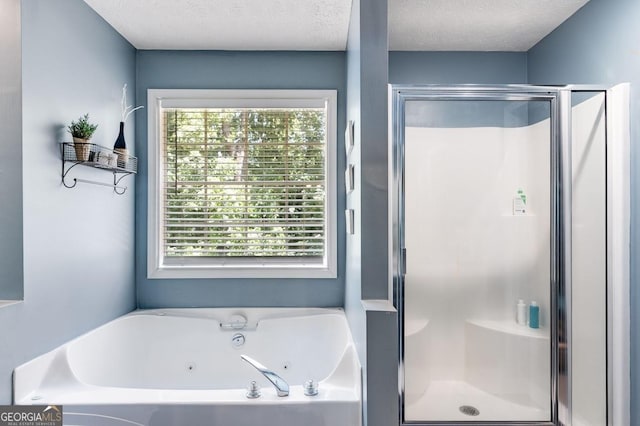 112 Hightower Rd, Hiram, GA 30141 - bathroom with a textured ceiling, a healthy amount of sunlight, a shower stall, and a jetted tub