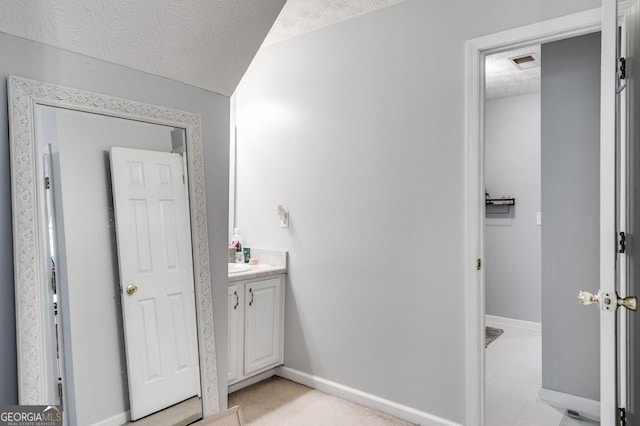 112 Hightower Rd, Hiram, GA 30141 - bathroom with a textured ceiling, visible vents, vanity, and baseboards