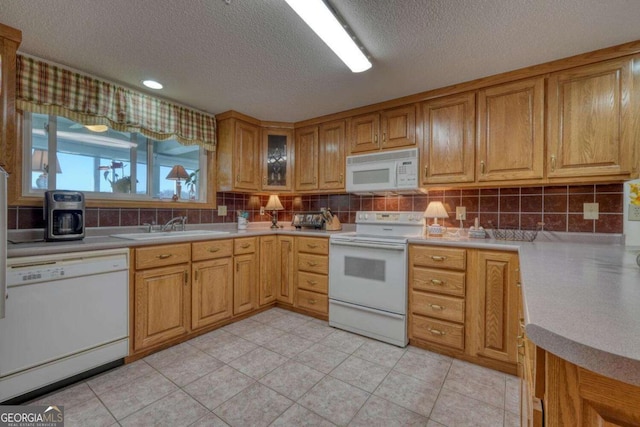3131 Allison Ct Unit 3A, Young Harris, GA 30582 - kitchen with white appliances, light countertops, backsplash, a sink, and a textured ceiling
