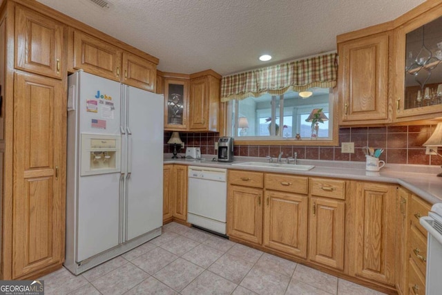 3131 Allison Ct Unit 3A, Young Harris, GA 30582 - kitchen with a textured ceiling, decorative backsplash, a sink, light countertops, and white appliances