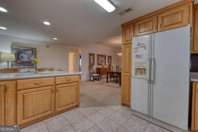 3131 Allison Ct Unit 3A, Young Harris, GA 30582 - kitchen featuring a textured ceiling, white fridge with ice dispenser, light colored carpet, visible vents, and recessed lighting