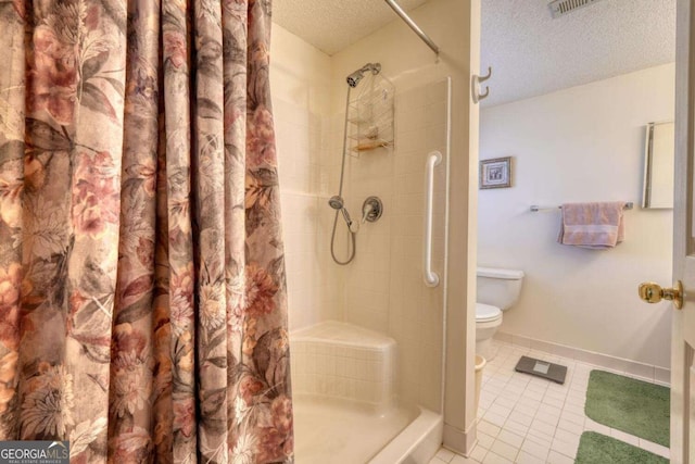 3131 Allison Ct Unit 3A, Young Harris, GA 30582 - bathroom with tiled shower, tile patterned floors, toilet, baseboards, and a textured ceiling