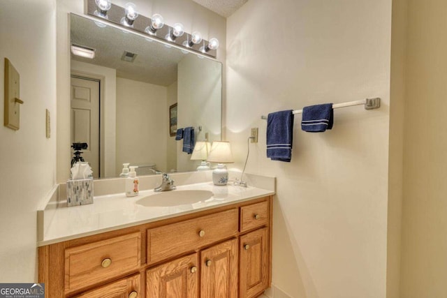 3131 Allison Ct Unit 3A, Young Harris, GA 30582 - bathroom with a textured ceiling, visible vents, and vanity