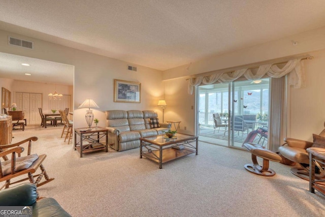 3131 Allison Ct Unit 3A, Young Harris, GA 30582 - living area with a chandelier, visible vents, a textured ceiling, and carpet flooring