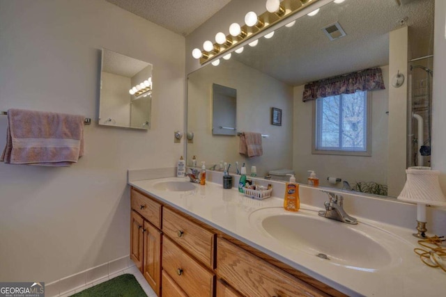 3131 Allison Ct Unit 3A, Young Harris, GA 30582 - full bath with double vanity, a textured ceiling, visible vents, and a sink