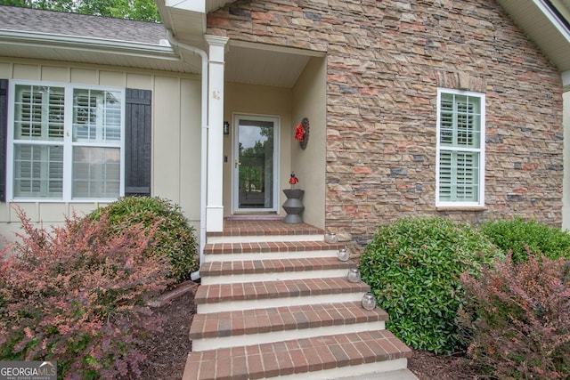 view of exterior entry with stone siding