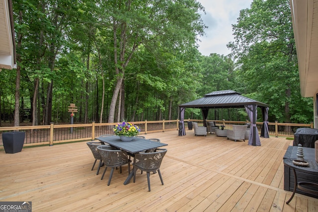 wooden deck featuring an outdoor living space, a gazebo, and outdoor dining area