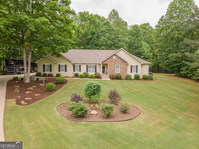 single story home featuring stucco siding, roof with shingles, and a front yard