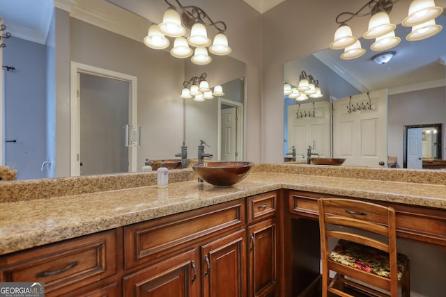 bathroom with an inviting chandelier, ornamental molding, and vanity