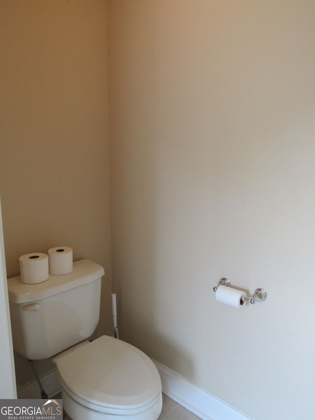 bathroom featuring toilet and tile patterned floors