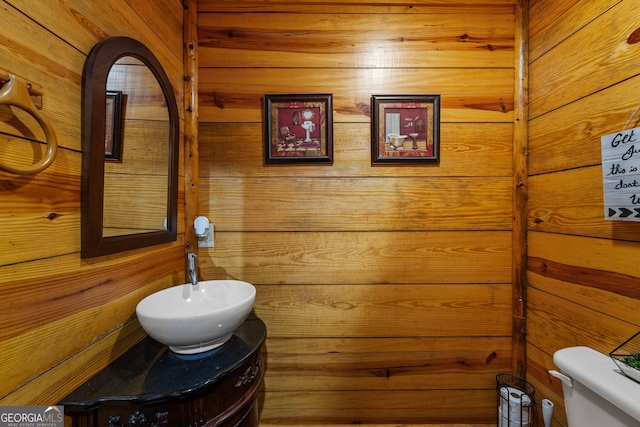 361 Meadow Ln, Talking Rock, GA 30175 - half bathroom featuring toilet, wooden walls, and vanity