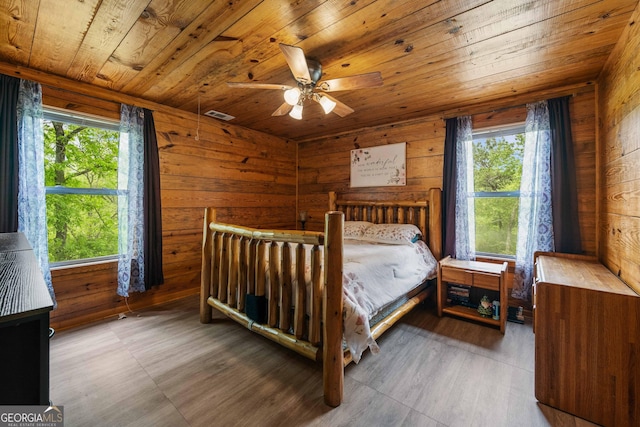 361 Meadow Ln, Talking Rock, GA 30175 - bedroom with wood finished floors, wooden ceiling, wood walls, and multiple windows