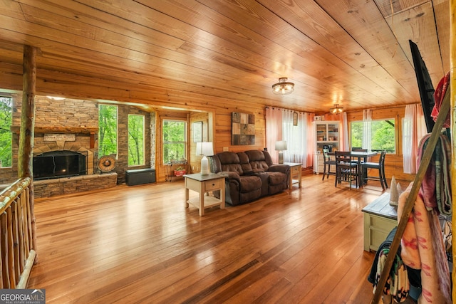 361 Meadow Ln, Talking Rock, GA 30175 - living area with a stone fireplace, hardwood / wood-style flooring, and wood ceiling