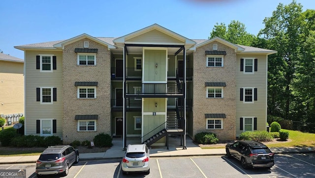 350 Wood Lake Dr Unit 13, Athens, GA 30606 - view of building exterior with uncovered parking