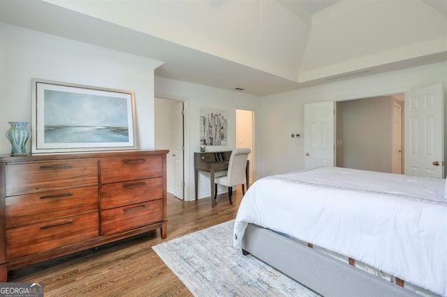 bedroom featuring wood finished floors
