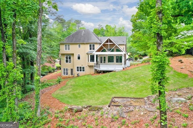 back of property featuring a lawn