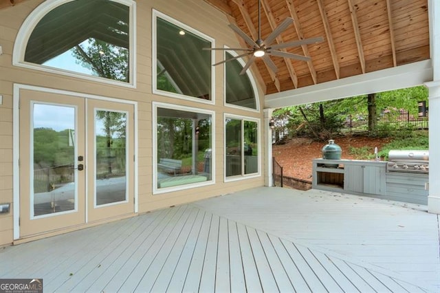 wooden terrace with grilling area, ceiling fan, and french doors