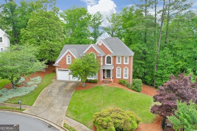 colonial house featuring concrete driveway, brick siding, a front yard, and a garage