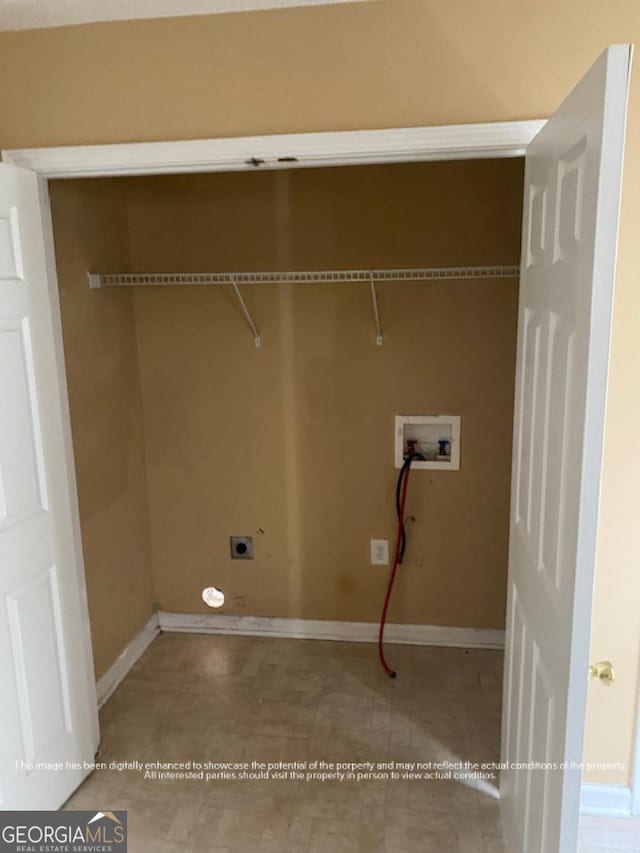 laundry room featuring electric dryer hookup, washer hookup, laundry area, and baseboards