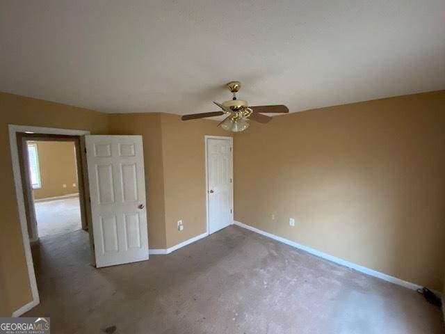 unfurnished bedroom featuring baseboards and carpet floors