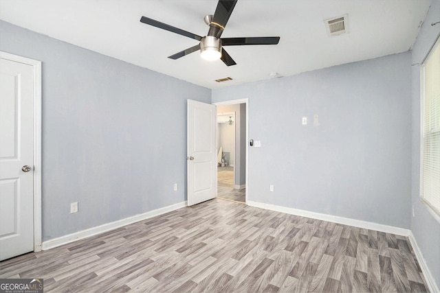 248 Upshaw St SW, Atlanta, GA 30315 - unfurnished bedroom with light wood finished floors and a ceiling fan