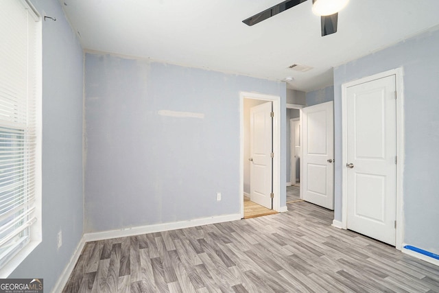 248 Upshaw St SW, Atlanta, GA 30315 - unfurnished bedroom with light wood-style flooring and a ceiling fan