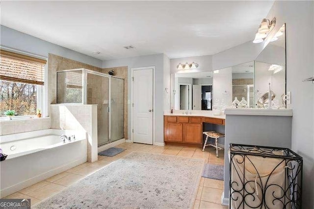 233 Hampton Station Blvd, Canton, GA 30115 - bathroom featuring a garden tub, visible vents, vanity, tile patterned floors, and a stall shower