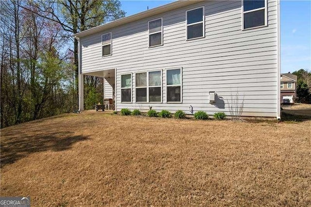 233 Hampton Station Blvd, Canton, GA 30115 - rear view of house featuring a lawn