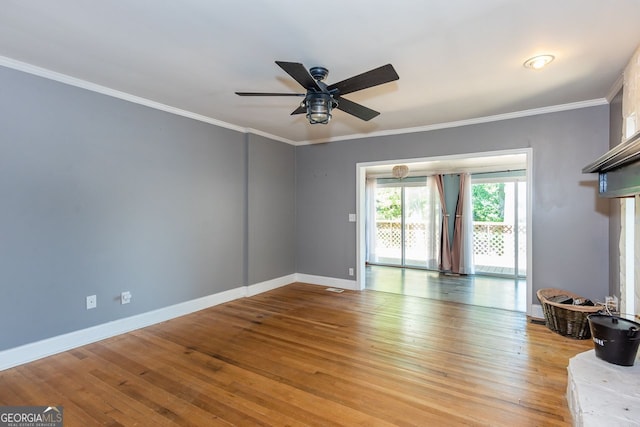 2240 Lake Dr NE, Conyers, GA 30012 - living area featuring ceiling fan, baseboards, light wood finished floors, and crown molding