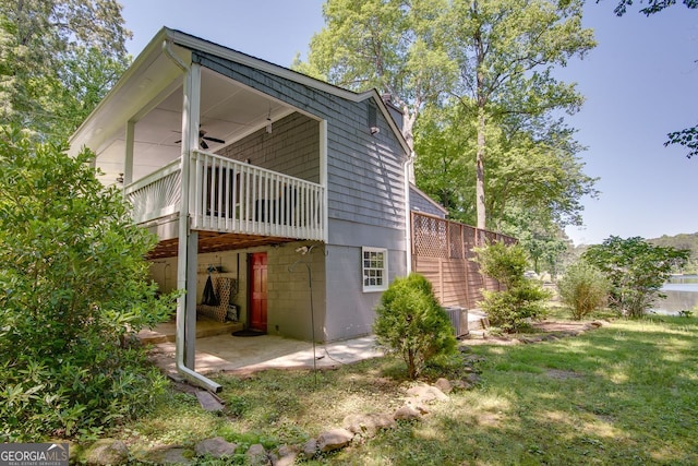 2240 Lake Dr NE, Conyers, GA 30012 - rear view of property featuring a patio, a yard, and a deck