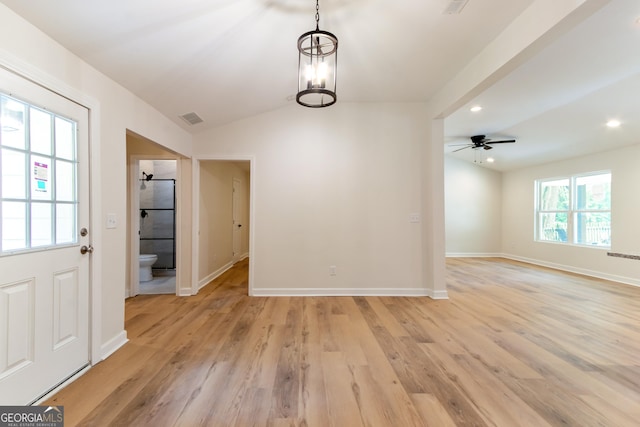 interior space with visible vents, ceiling fan, light wood finished floors, and baseboards
