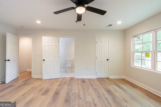 unfurnished bedroom featuring light wood finished floors, recessed lighting, visible vents, and baseboards