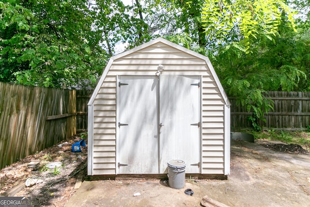 view of shed with a fenced backyard