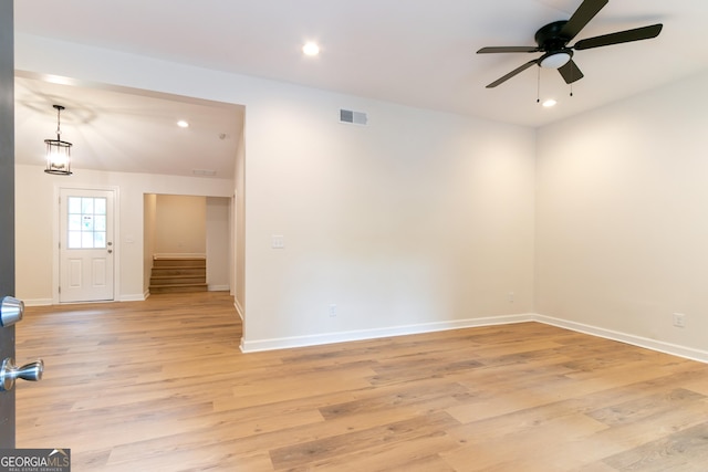 empty room featuring visible vents, light wood-style floors, baseboards, recessed lighting, and a ceiling fan