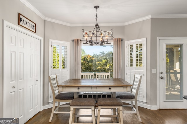 dining room with an inviting chandelier, dark wood-style flooring, and crown molding
