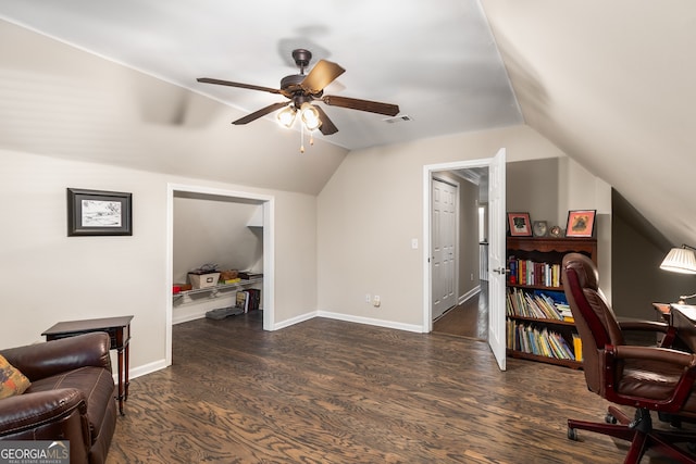 home office with visible vents, baseboards, vaulted ceiling, wood finished floors, and a ceiling fan