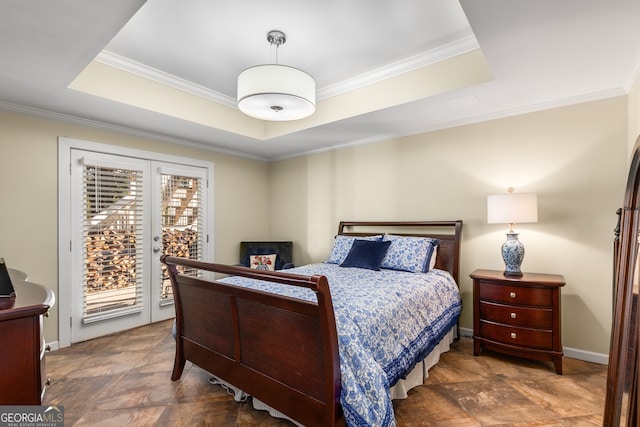 bedroom with a raised ceiling, access to outside, stone finish floor, and ornamental molding