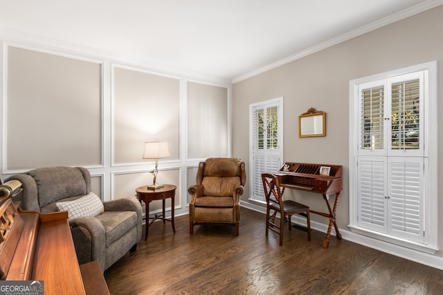 sitting room with ornamental molding and dark wood-style floors