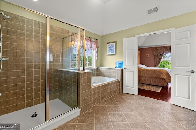 ensuite bathroom with tile patterned floors, visible vents, a shower stall, and ensuite bathroom