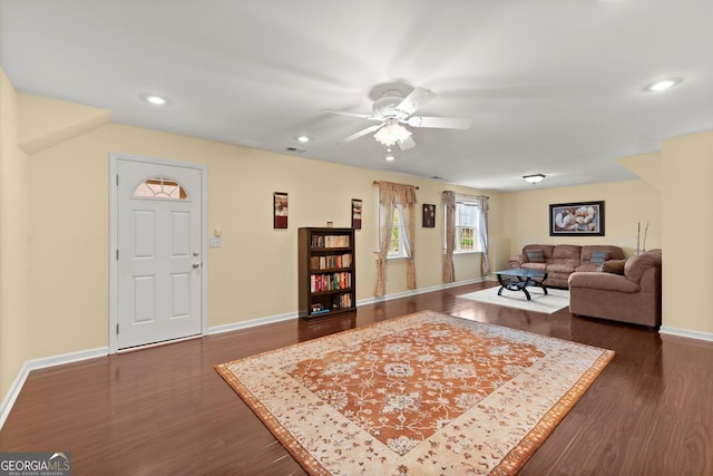 living area with dark wood-style flooring, a ceiling fan, recessed lighting, baseboards, and visible vents