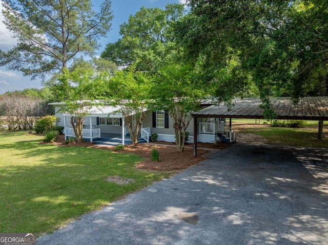 168 Chapman St Unit 1And16, Norman Park, GA 31771 - view of front of home featuring covered porch, a carport, aphalt driveway, and a front yard