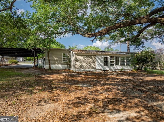 168 Chapman St Unit 1And16, Norman Park, GA 31771 - view of front of house featuring a carport