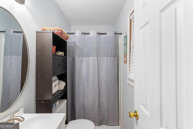full bath with a shower with curtain, toilet, and vanity