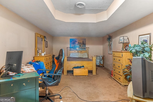 carpeted office space featuring a textured ceiling