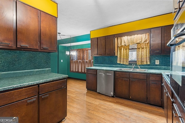 kitchen featuring tasteful backsplash, light wood-style flooring, dark brown cabinets, dishwasher, and a sink