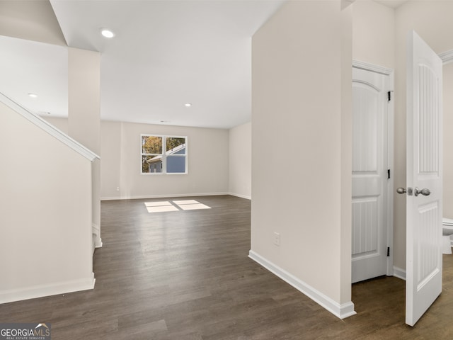 8230 Coldstream Dr, Fairburn, GA 30213 - unfurnished living room with dark wood-style flooring and recessed lighting