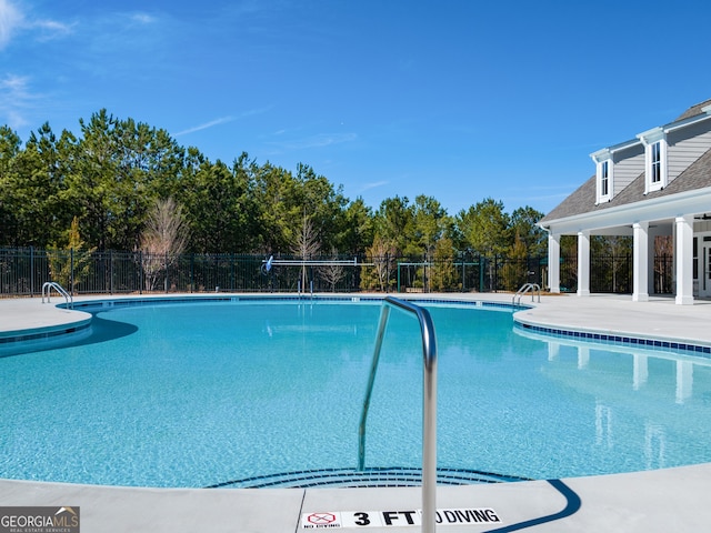 8230 Coldstream Dr, Fairburn, GA 30213 - community pool with a patio area and view of scattered trees